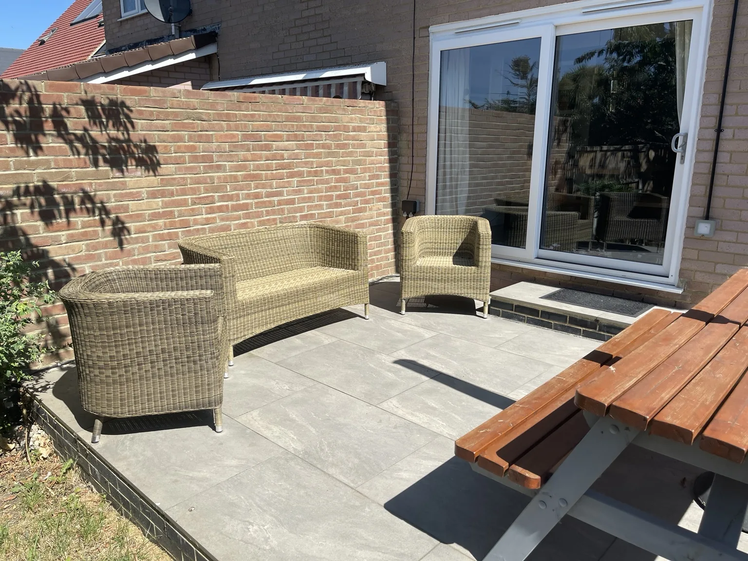 Private rear garden and patio viewed from the lawn